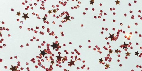 Banner with golden shiny stars and crystals confetti on a blue background. Glowing texture.