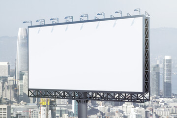 Blank white horizontal billboard on skyline background at daytime, perspective view. Mock up, advertising concept