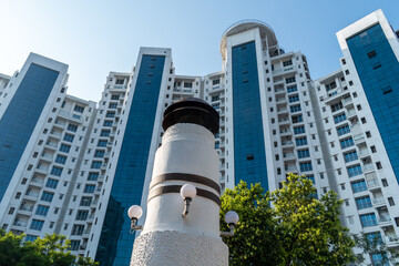 The old Lighthouse built by Hyder Ali surrounded by tall modern high rise apartment buildings in...