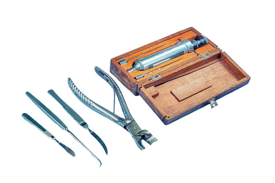 Ancient hospital for treatment soldiers on battlefield - 18th or 19th century, isolated on a white background. Forceps, syringe, scissors, scalpel and other medical instruments