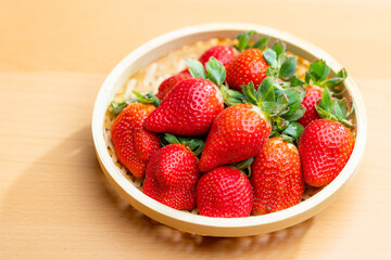 Ripe and luscious strawberries in a basket