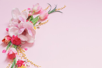 beautiful spring flowers on pink background