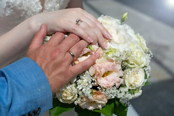 wedding bouquet in the hands of the bride and groom. concept for event agencies