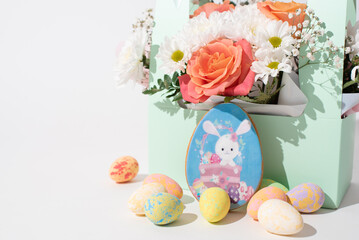Easter still life, spring flowers and easter eggs on white . Religious holiday card and banner. White space for text