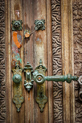 Wooden doors and inlaid door handles of Peles castle