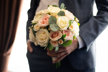 man with a bouquet in his hands