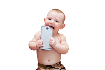Funny happy baby boy gnaws a phone in his hands. Smiling child holds a smartphone,, isolated on a white background