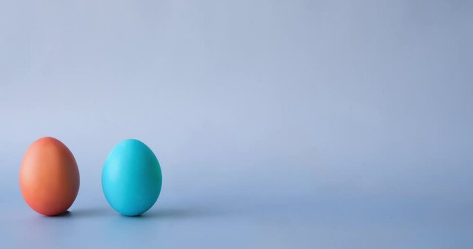 Row of colorful Easter eggs. Looped 4K stop motion animation
