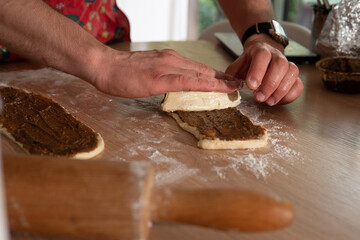 the process of making chocolate cake by a man in the kitchen
