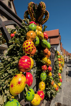Traditionally decorated easter fountain seen in Bavaria (Germany). Easter fountain. Osterbrunnen. Traditional german easter eggs outdoor decoration. Rothenburg ob der Tauber, Bavaria