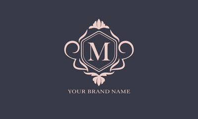 Exquisite baroque pattern. Floral ornament with initial letter M. Vintage frame, greeting card, wedding invitation. Vector logo template, label, business sign.
