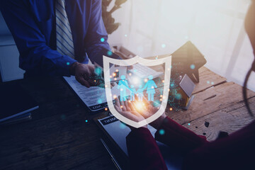 Businessman with protective gesture and family, life, health and house insurance icons. Insurance...