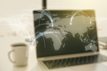 Double exposure of abstract digital world map with connections on laptop background, research and strategy concept