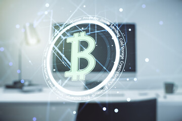 Double exposure of creative Bitcoin symbol with modern laptop on background. Cryptocurrency concept