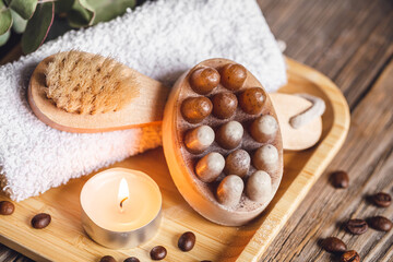Obraz na płótnie Canvas Spa composition with coffee massage scrub soap on a wooden surface.