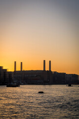 Obraz premium View of silhouetted Battersea Power Station at sunset over the river Thames from Vauxhall, London, England, UK