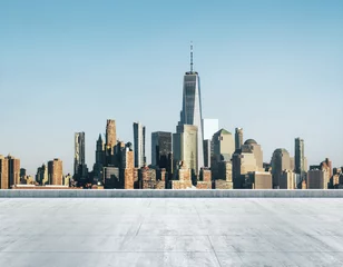 Fototapeten Empty concrete dirty rooftop on the background of a beautiful New York city skyline at morning, mock up © Pixels Hunter