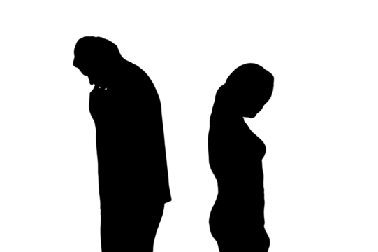 Silhouette of sad man and woman in a quarrel, isolated on a white background. Divorce of husband and wife in the evening light of the home living room