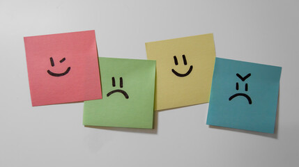 Sticker notes on the white background. Sticky note papers with smiley. Winking, sad, happy and...