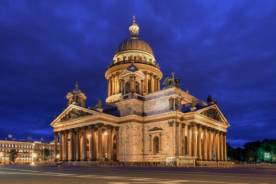 St. Isaac's Cathedral in Saint Petersburg at night. Translation: 'My temple shall be called a temple of prayer' (left), 'In you, O Lord, we hope, that we may not be ashamed forever' (right)