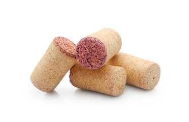 Cheap extruded agglomerated wine corks with red wine trace isolated on white background  