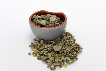 Origanum dictamnus, Dittany of Crete tea in a bowl on a white background. Cretan dittany or hop marjoram is a medicinal tea growing wild only in Crete. It is a healing, therapeutic and aromatic plant