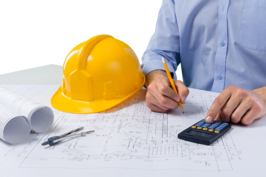 Male Architect Drawing On Blueprint, Using Calculator