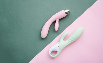 A set of toys for adults on a green and pink background - 580803291
