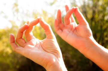 Yoga Girl Meditating Outoor And Making A Zen Symbol With Her Hand.