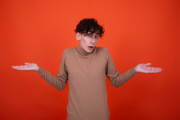 Funny young man surprised by his work.