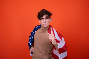 Attractive young man with an American flag
