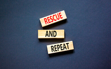 Rescue and repeat symbol. Concept words Rescue and repeat on wooden block on a beautiful black...