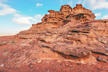 Fototapeta na wymiar Red orange sandstone rocks formations in Wadi Rum (also known as Valley of the Moon) desert, Jordan