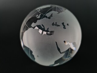 Glass globe on black background reflection of circle