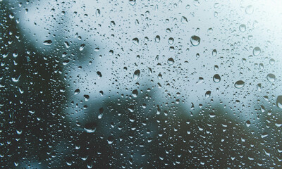 Sun after rain. Drops on glass. It's been raining. Texture on glass.