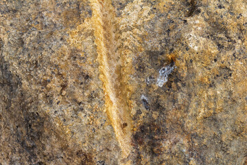 walls in a mountain cave, natural stone, cut structure, material for construction work and design solutions.