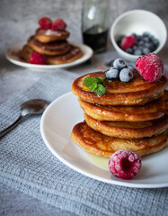 
Pancakes with berries. breakfast. On a concrete background