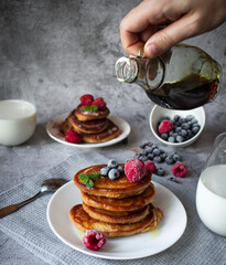 
Pancakes with berries. breakfast. On a concrete background
