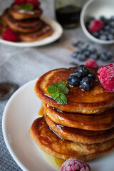 
Pancakes with berries. breakfast. On a concrete background
