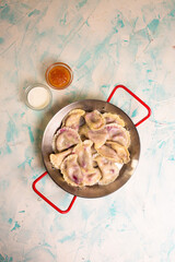 top view juicy dumplings with berries and jam in a cafe