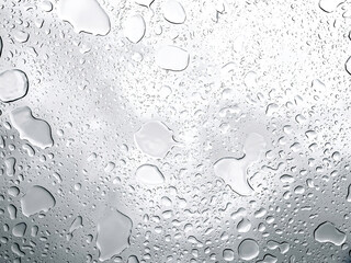 Raindrops on the window close-up, abstract natural background.