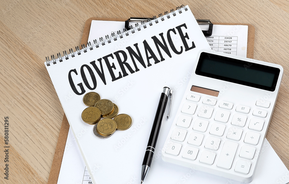 Poster governance text on a notebook with chart and calculator and coins, business concept