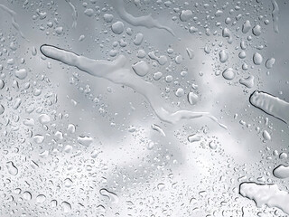 Raindrops on the window close-up, abstract natural background.