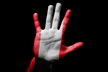 man hand with flag of Peru in stop sign