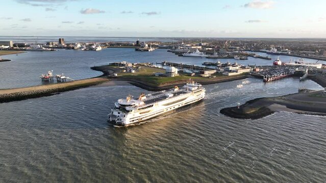 An aerial view of the Texelstroom ferry boat leaving Den Helder, as it embarks on a scenic voyage towards Texel.