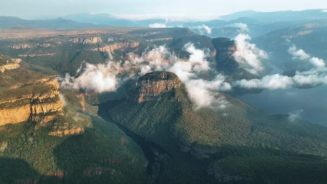 Aerial view of Blyde River Canyon with low clouds, a natural attraction with mountains and wildlife, South Africa.