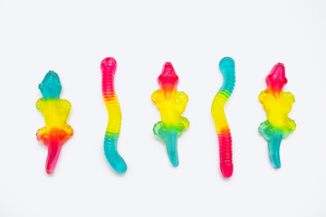 Jelly marmalade candies of different shapes on a white background. Colorful sweet confectionery on...