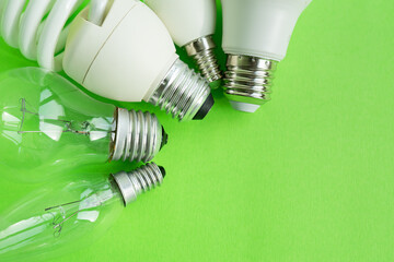 A set of different types of LED lamps isolated on a green background. Energy-saving lamps.