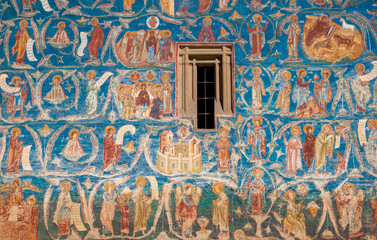 Religious paintings on the wall of Voronet monastery - Romania