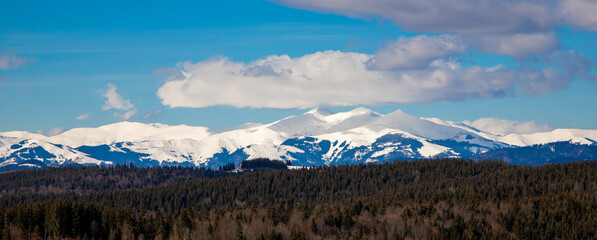 Landscape with mountains covered with snow in the background